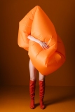 Creative Fashion Concept with Orange Inflatable Outfit