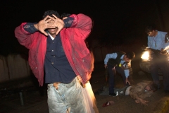 Iraqi police on patrol arrest suspected thieves. BAGHDAD IRAQ, 2003. Ⓒ Ed Kashi