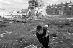 Locals make final preparations for the Eleventh night bonfire, which burns to usher i the Twelfth of July, the most important event of the year for Ulster Protestants. BELFAST, NORTHERN IRELAND, 1989. Ⓒ Ed Kashi