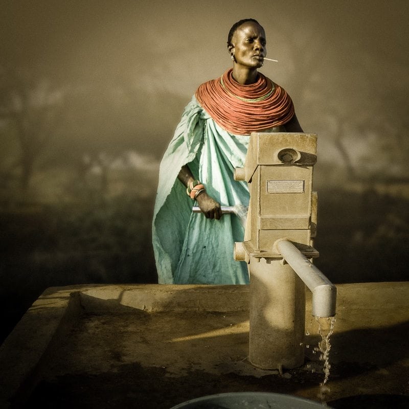 Evelyn at the well, Lbaa Onyokia